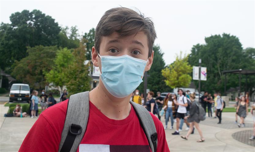 A student wears a mask
